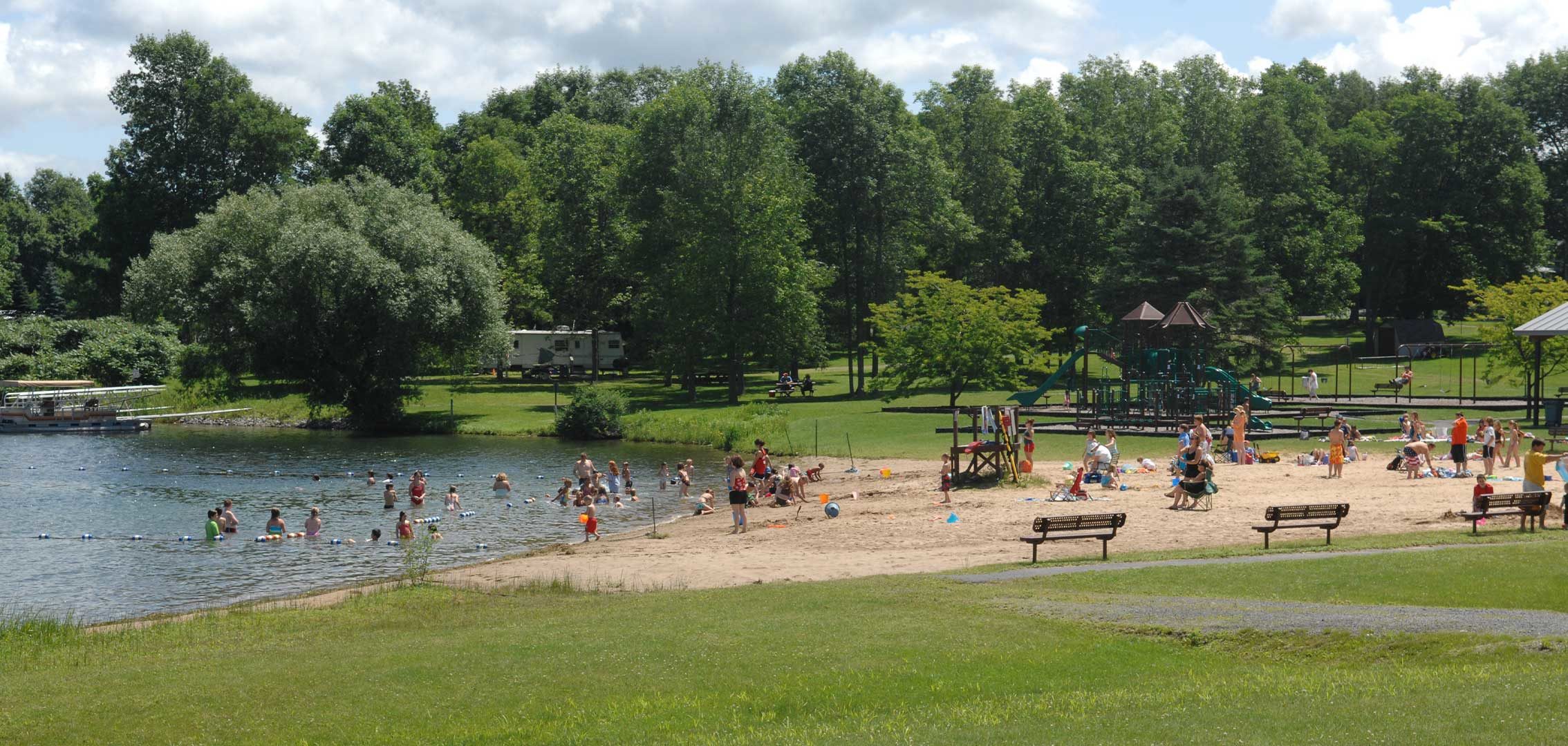 People cooling off in a recreational swimming pond