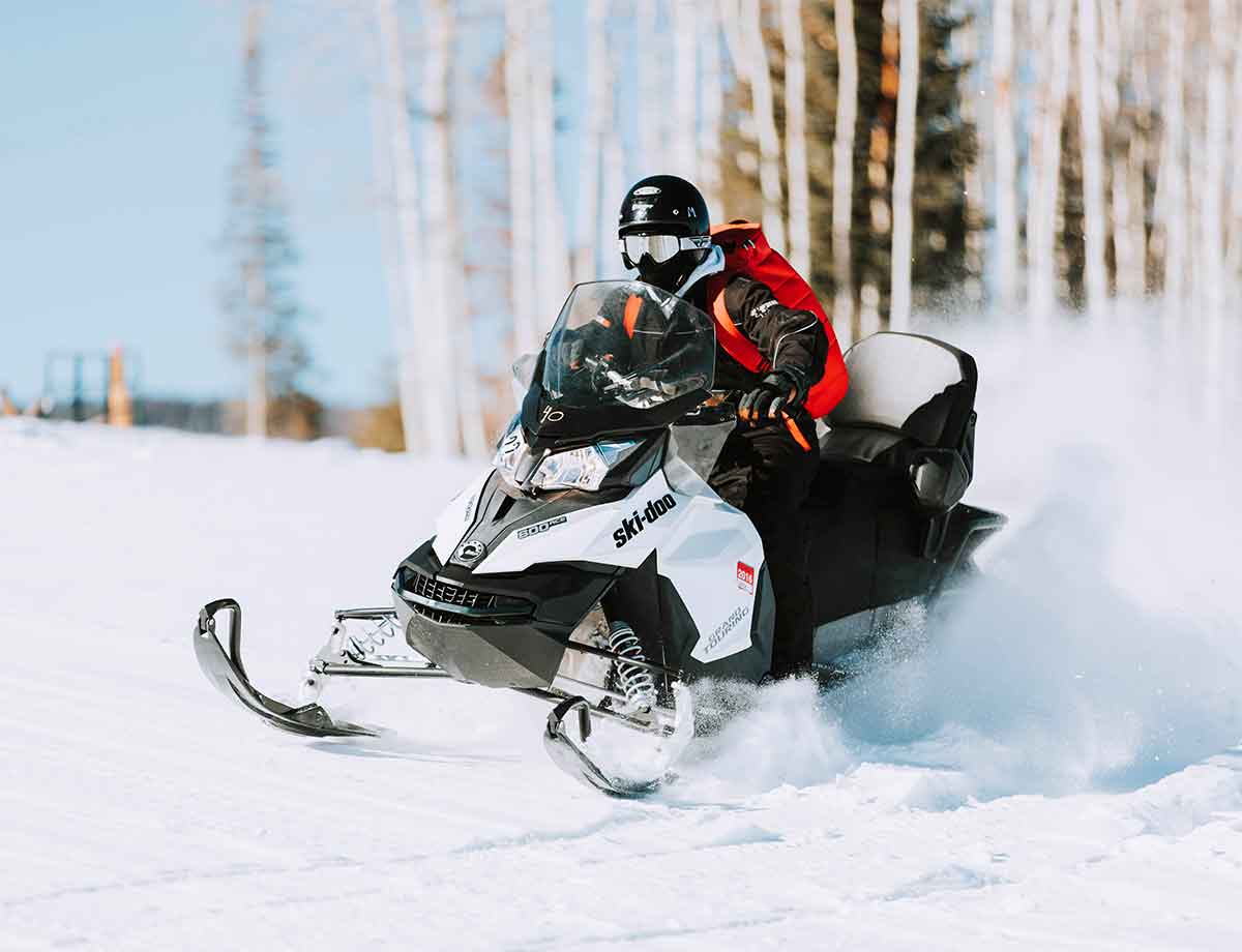 A sledder on a snowmobile