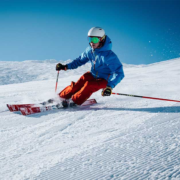 A skier sloping down a mountain