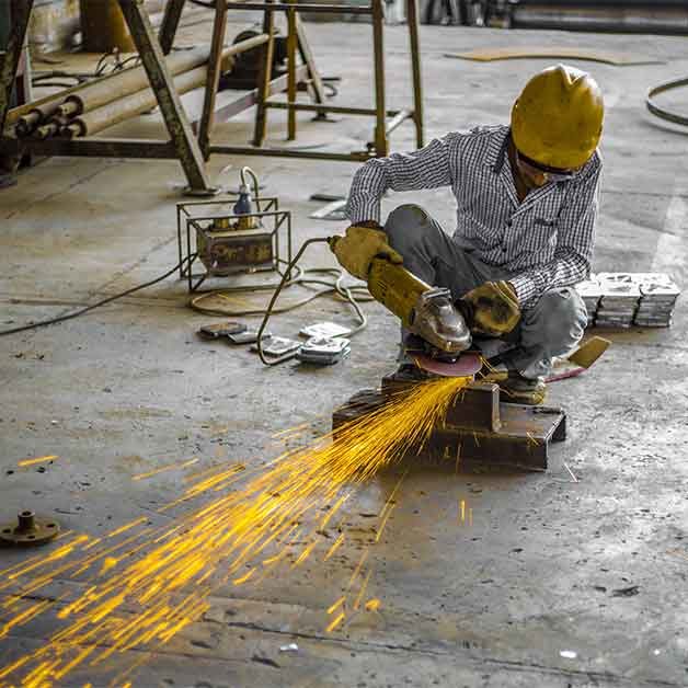 A worker training to weld